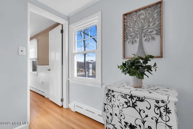 a dining room with furniture and a window