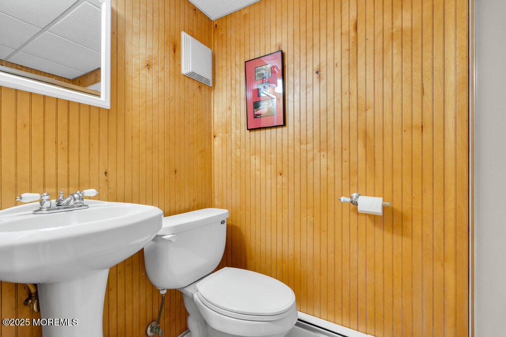 1798 Todd Road Toms River, NJ 08755 - Photo 37 of 61 a bathroom with a sink a toilet and shower curtain