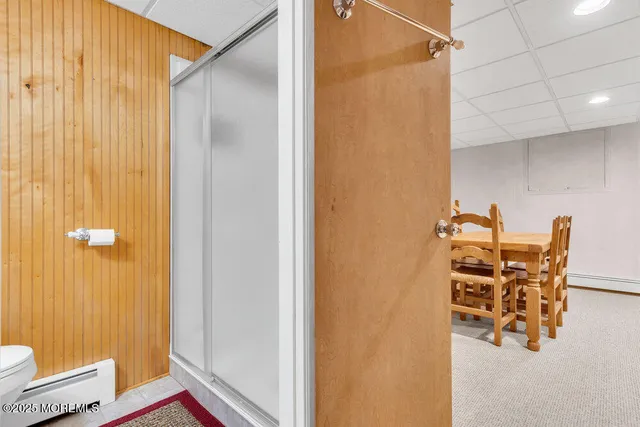 a bedroom with a bed and a mirror