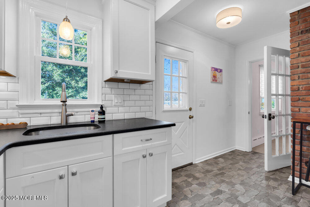 1798 Todd Road Toms River, NJ 08755 - Photo 43 of 61 a kitchen with granite countertop a sink and a window