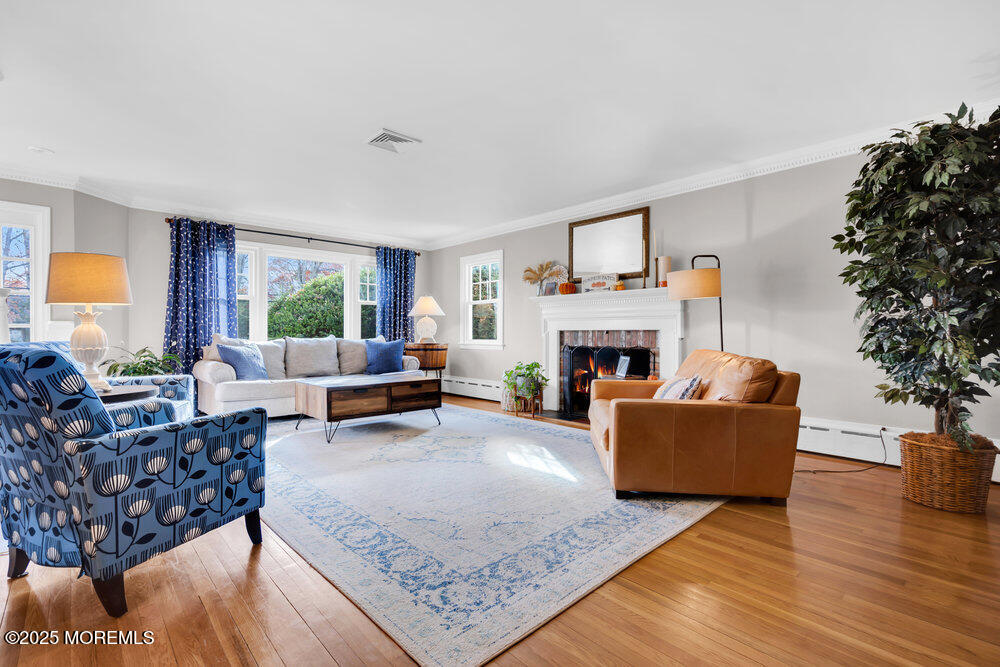 1798 Todd Road Toms River, NJ 08755 - Photo 8 of 61 a living room with furniture and a fireplace