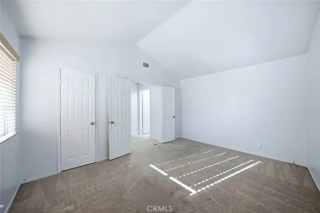 a view of a room that has a window in it