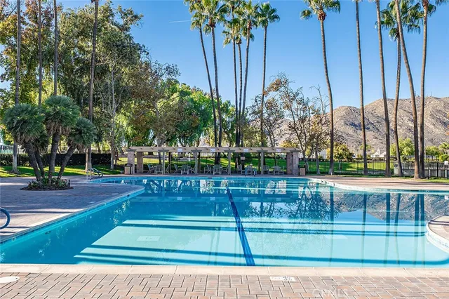 a view of a swimming pool and a yard