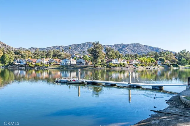 an aerial view of residential houses with city view