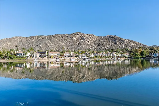 an aerial view of a house with a swimming pool yard and outdoor seating