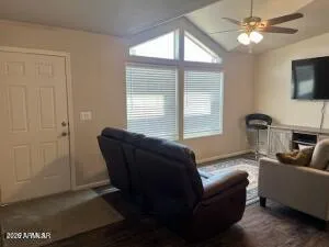 a living room with furniture and a window