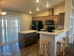 61 North 8620th Show Low, AZ 85901 - Photo 10 of 18 a kitchen with stainless steel appliances a refrigerator and a stove top oven