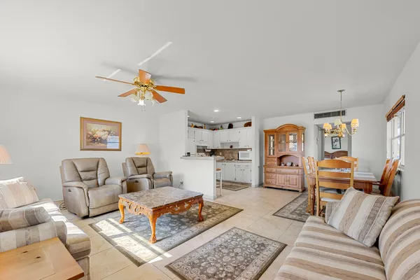 a living room with furniture and a rug
