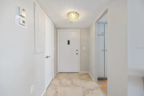 a kitchen with a cabinets and white appliances