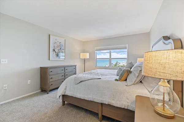 a bedroom with two beds and a window