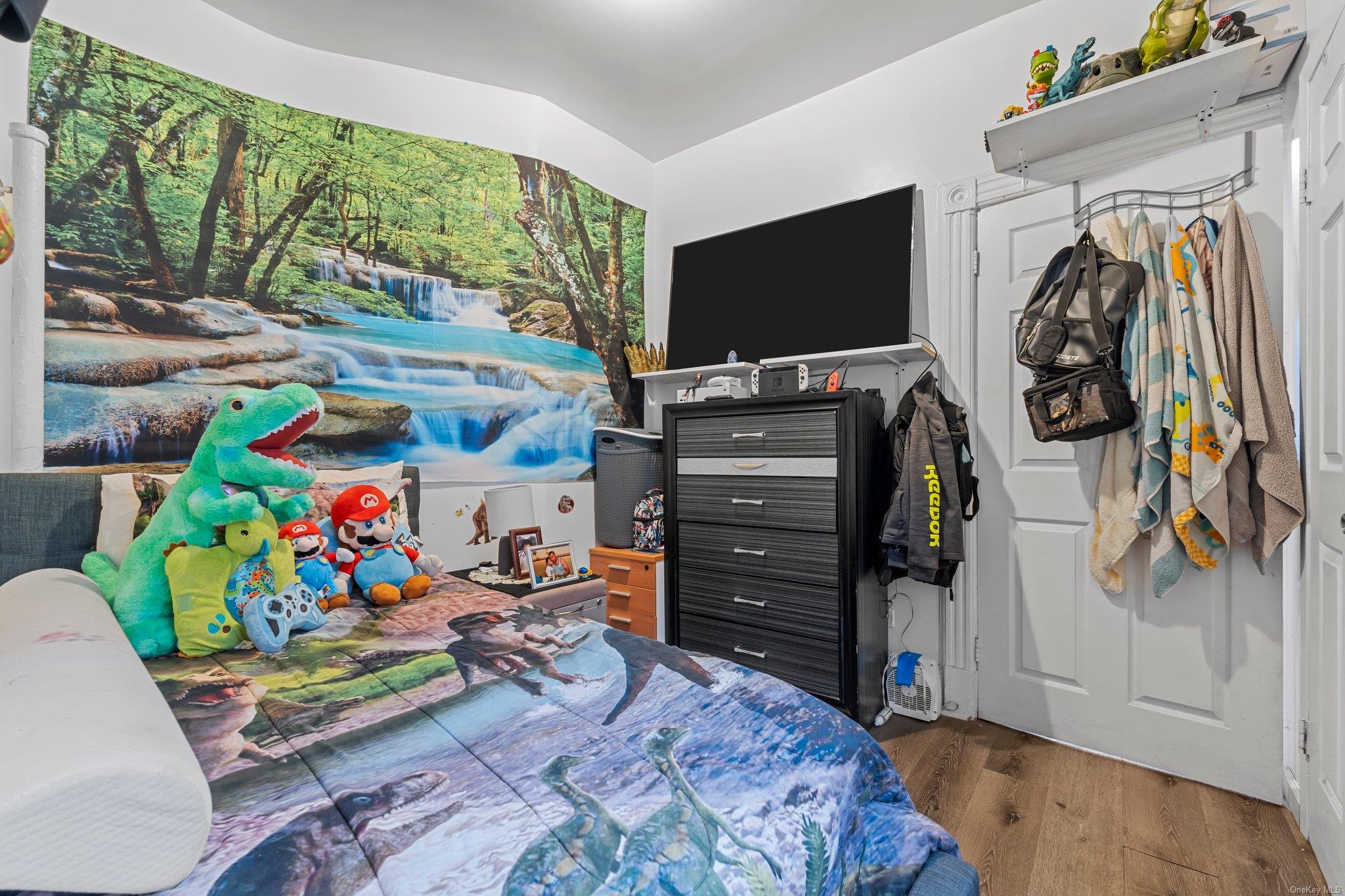 35-18 108th Street Queens, NY 11368 - Photo 15 of 20 Bedroom with lofted ceiling and dark hardwood / wood-style floors
