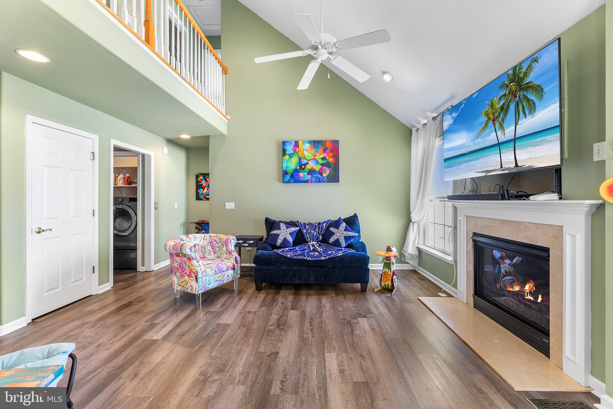 30249 Armory Road Dagsboro, DE 19939 - Photo 14 of 41 a living room with furniture and a fireplace