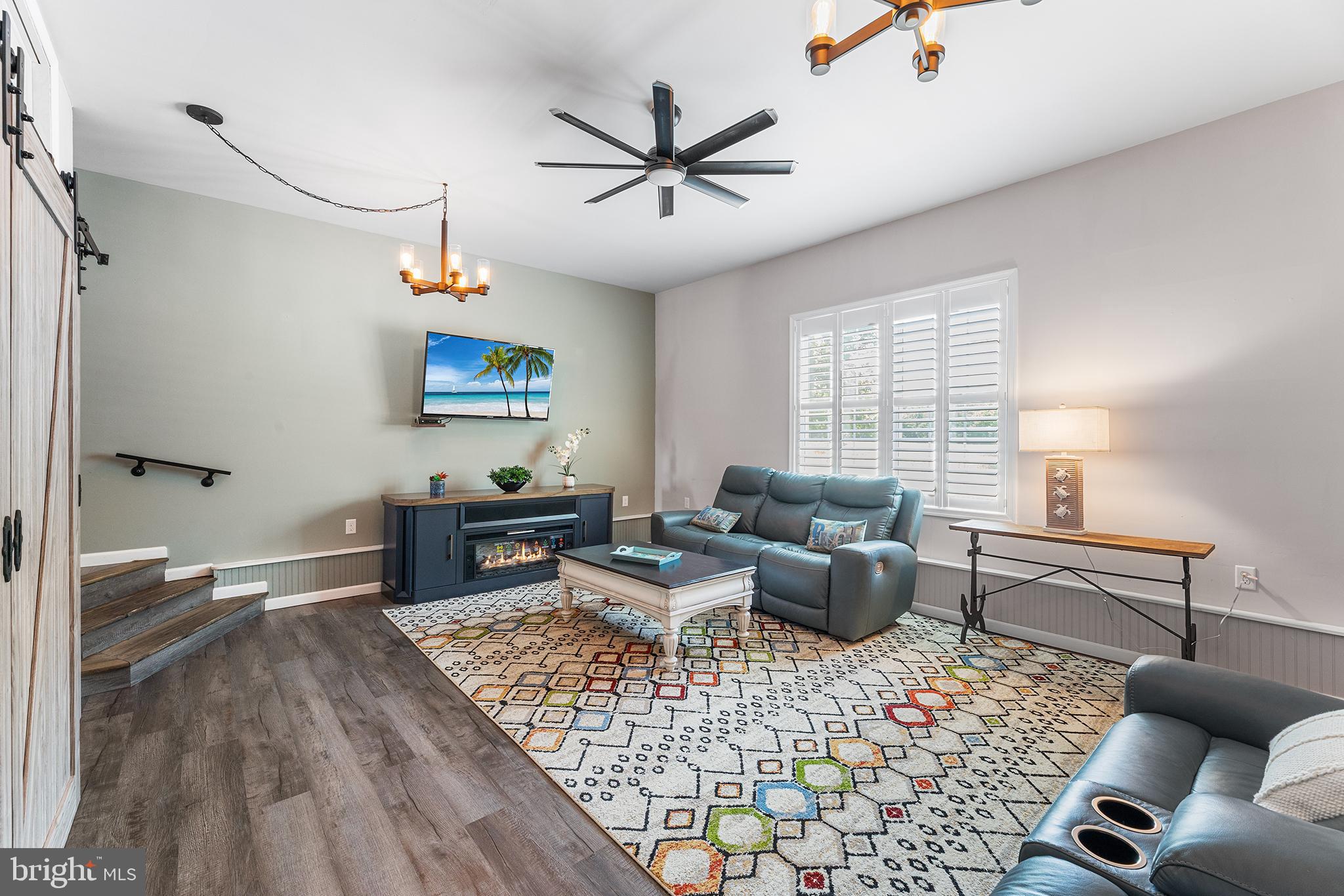 30249 Armory Road Dagsboro, DE 19939 - Photo 19 of 41 a living room with furniture a rug and a window