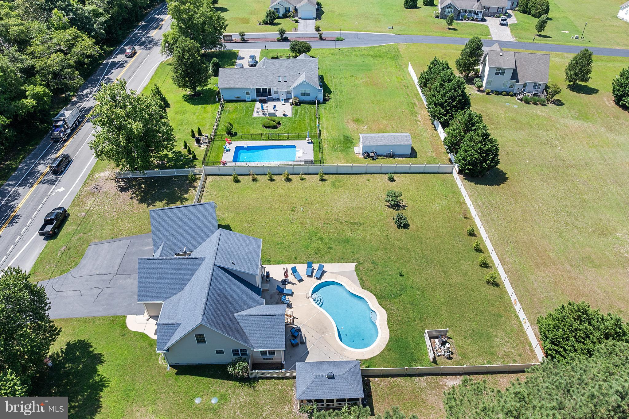 30249 Armory Road Dagsboro, DE 19939 - Photo 2 of 41 an aerial view of house with yard swimming pool and outdoor seating