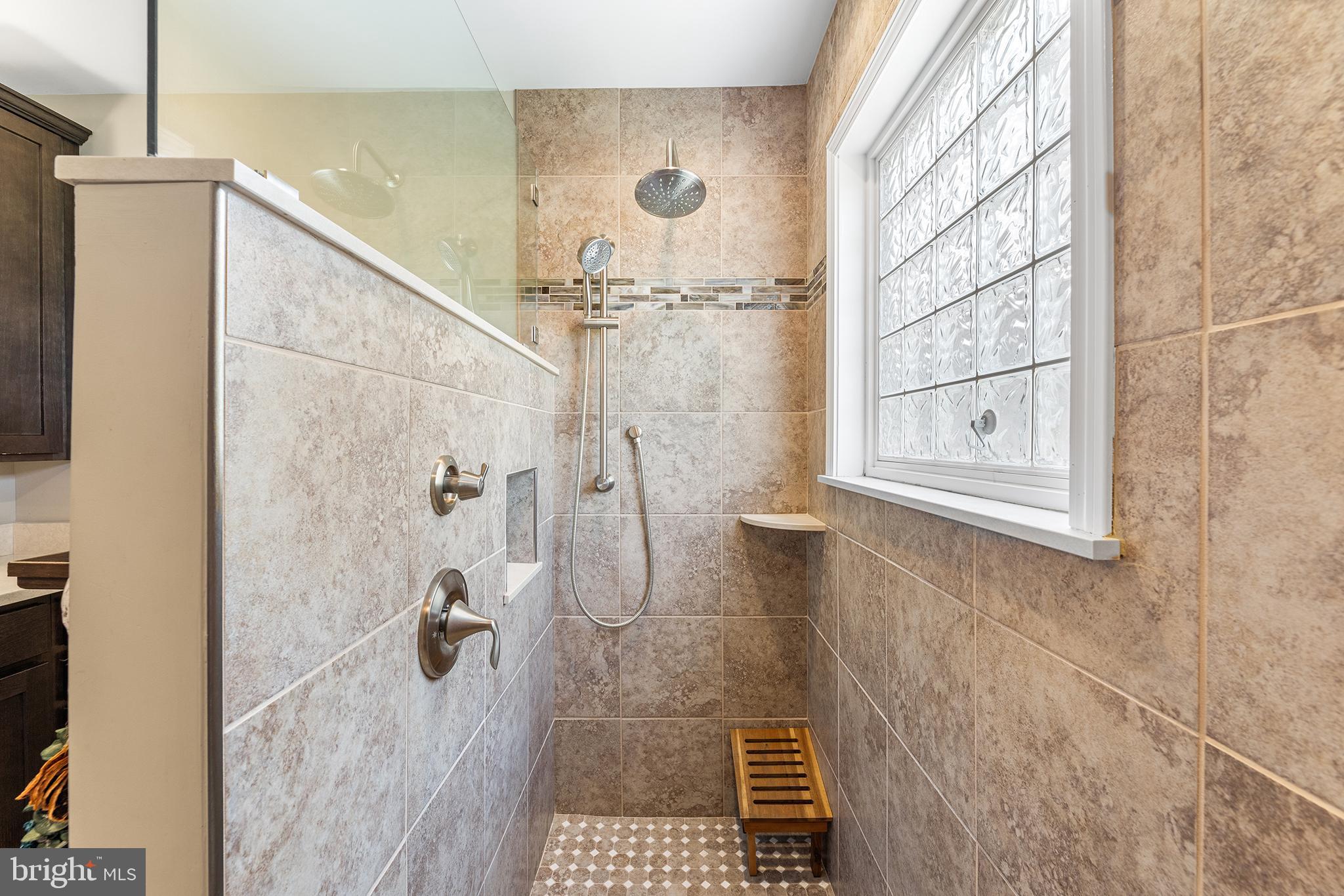 30249 Armory Road Dagsboro, DE 19939 - Photo 26 of 41 a bathroom with a glass shower door