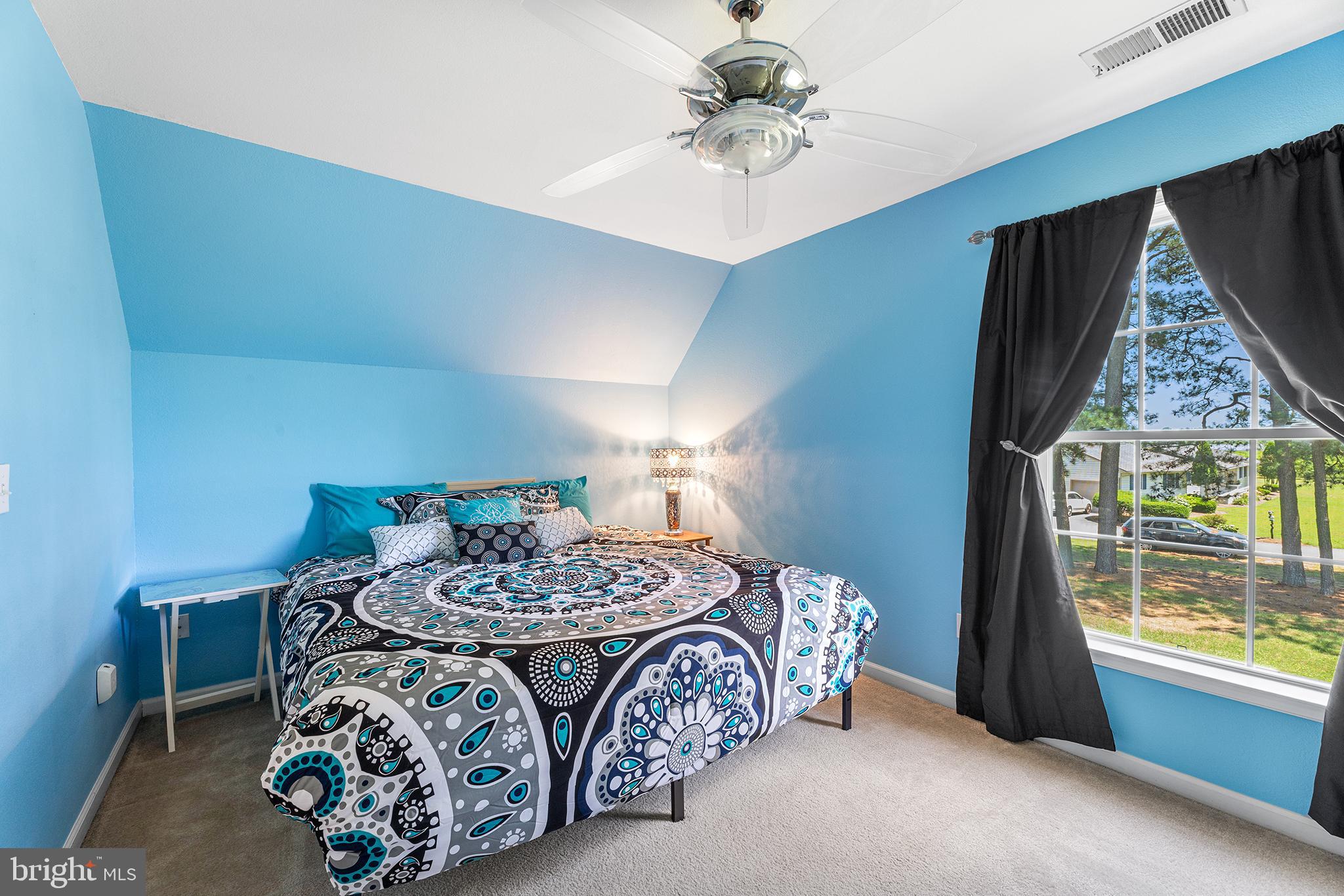 30249 Armory Road Dagsboro, DE 19939 - Photo 28 of 41 a bedroom with a bed and a window