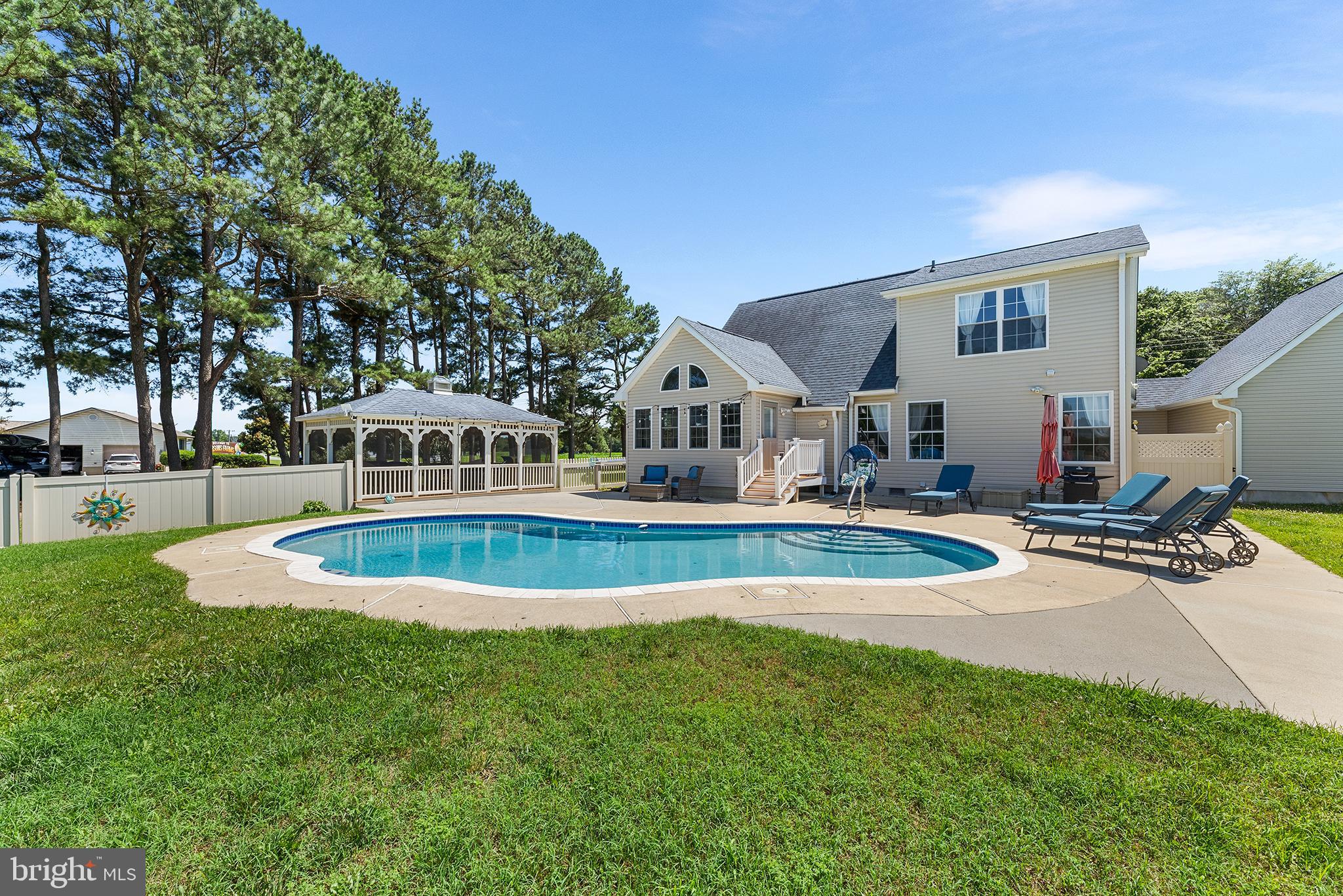 30249 Armory Road Dagsboro, DE 19939 - Photo 3 of 41 a view of a house with swimming pool and sitting area
