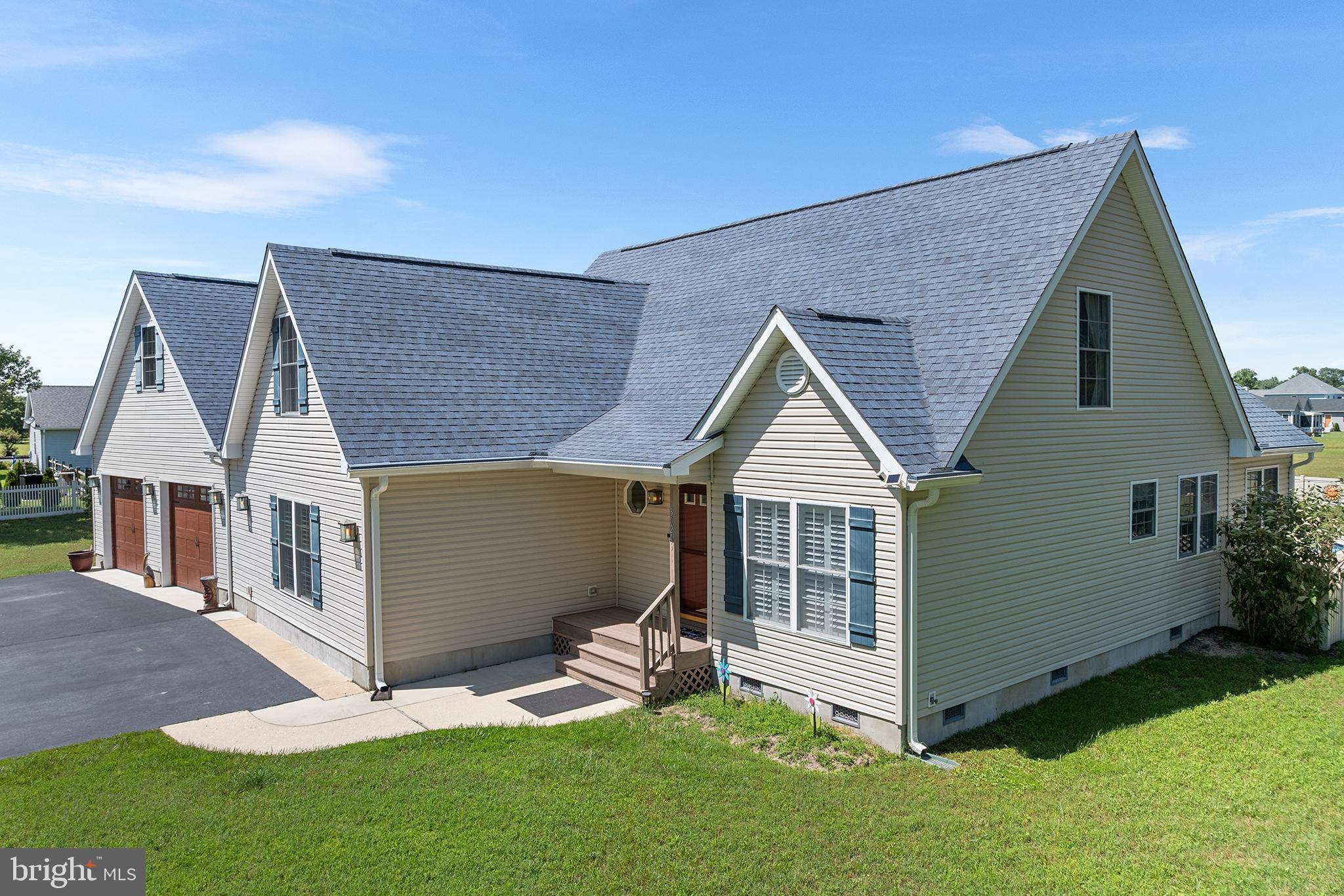 30249 Armory Road Dagsboro, DE 19939 - Photo 5 of 41 a view of backyard with a garden and deck
