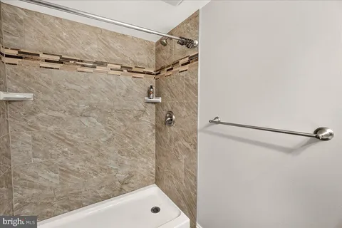 a utility room with sink dryer and washer