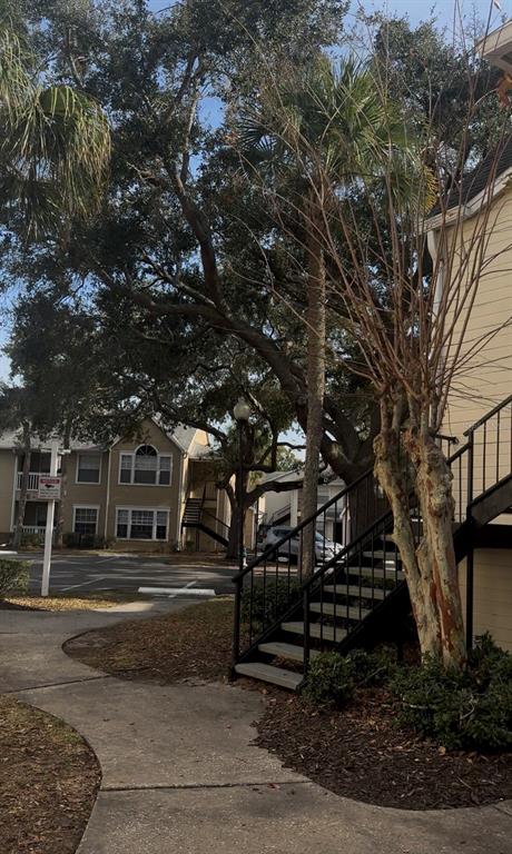 1017 South Hiawassee Road, Unit 3712 Orlando, FL 32835 - Photo 18 of 18 a building view with large trees