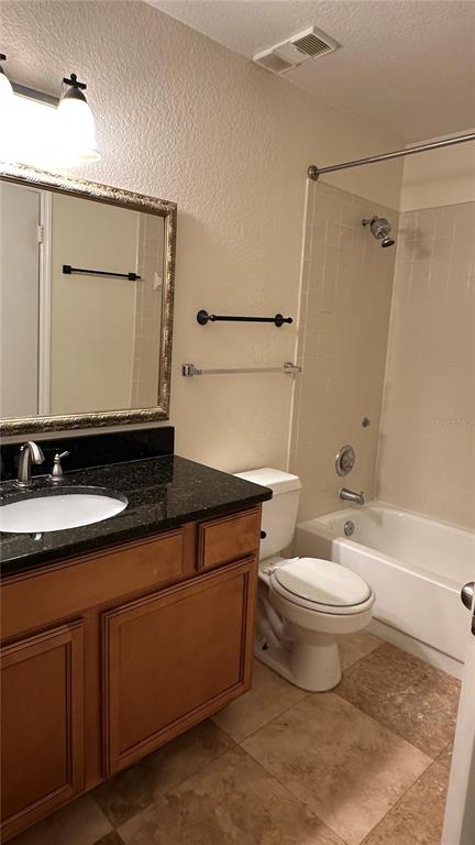 1017 South Hiawassee Road, Unit 3712 Orlando, FL 32835 - Photo 9 of 18 a bathroom with a sink toilet and shower