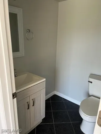 a bathroom with a sink and toilet