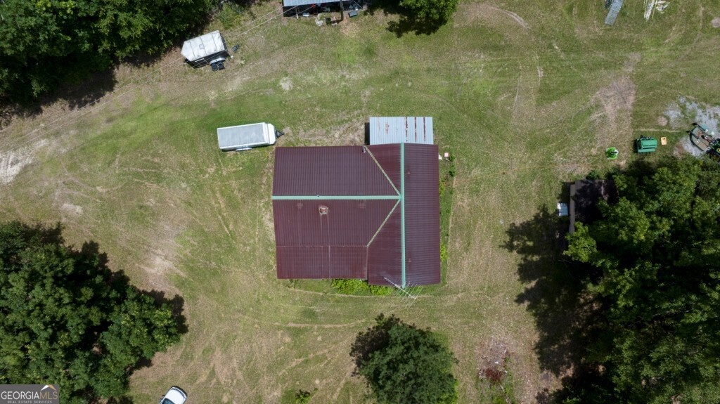 1230 Agricola Road Mitchell, GA 30820 - Photo 43 of 43 an aerial view of a house with a yard