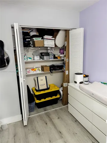 a bedroom with furniture and a chandelier