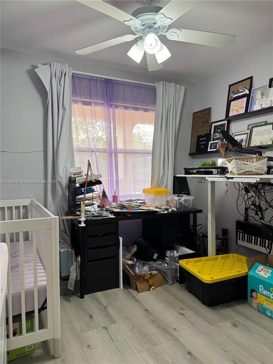 841 Northeast 207th Lane, Unit 3204 Miami, FL 33179 - Photo 12 of 37 a bedroom with furniture and a chandelier