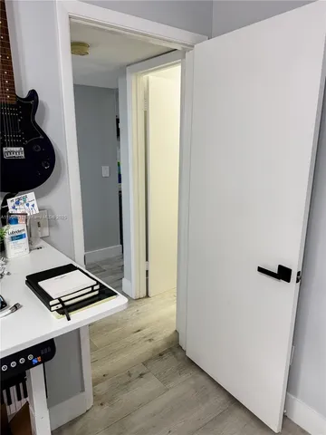 a bathroom with a sink toilet vanity and tub