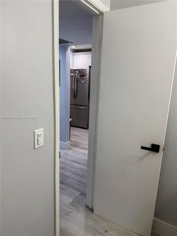 a view of a livingroom with furniture and a window