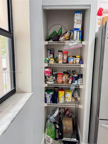 a dining room with furniture and a wooden floor