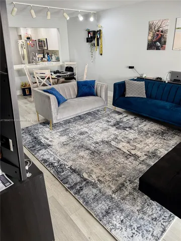 a bedroom with a bed and a large mirror