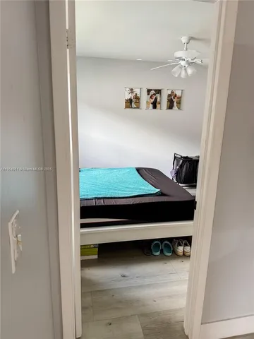 a view of a living room with closet and toys