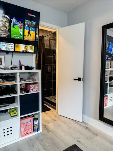 a bathroom with a toilet a sink and a mirror