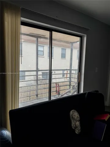 a view of balcony with wooden floor