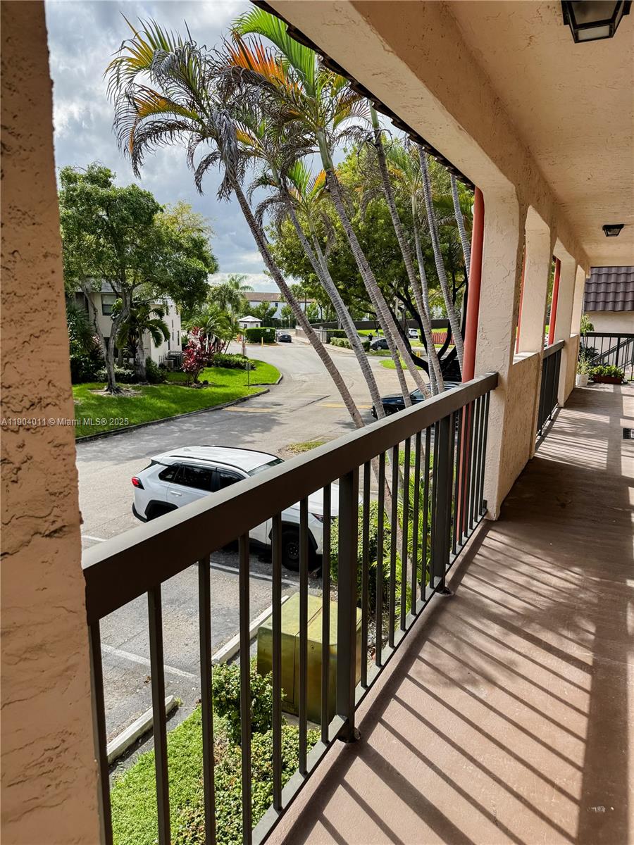 841 Northeast 207th Lane, Unit 3204 Miami, FL 33179 - Photo 35 of 37 a view of balcony with wooden floor