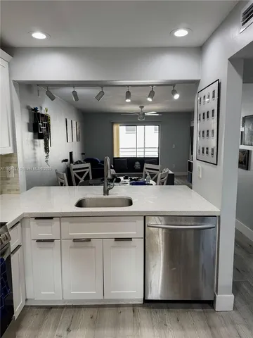 a kitchen with a stove and cabinets