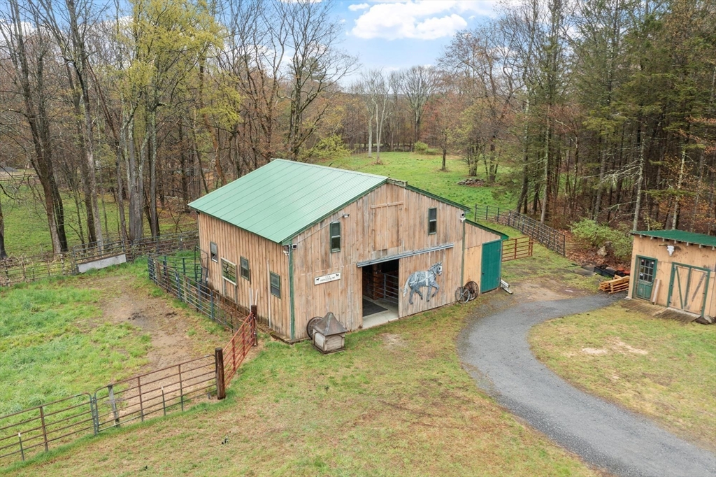 340 Ball Hill Road Princeton, MA 01541 - Photo 5 of 41 a view of a house with a yard balcony and wooden fence