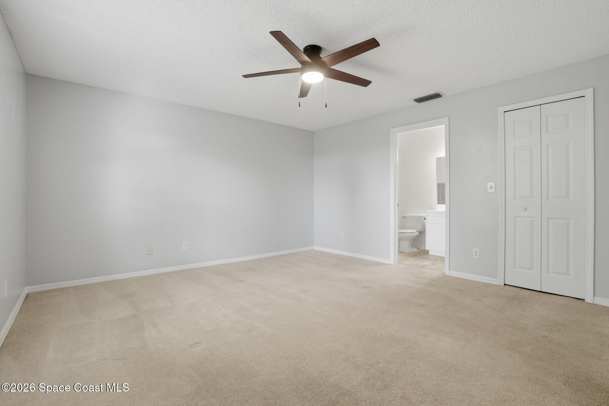 2005 Lansing Street Melbourne, FL 32935 - Photo 20 of 47 an empty room with closet and windows
