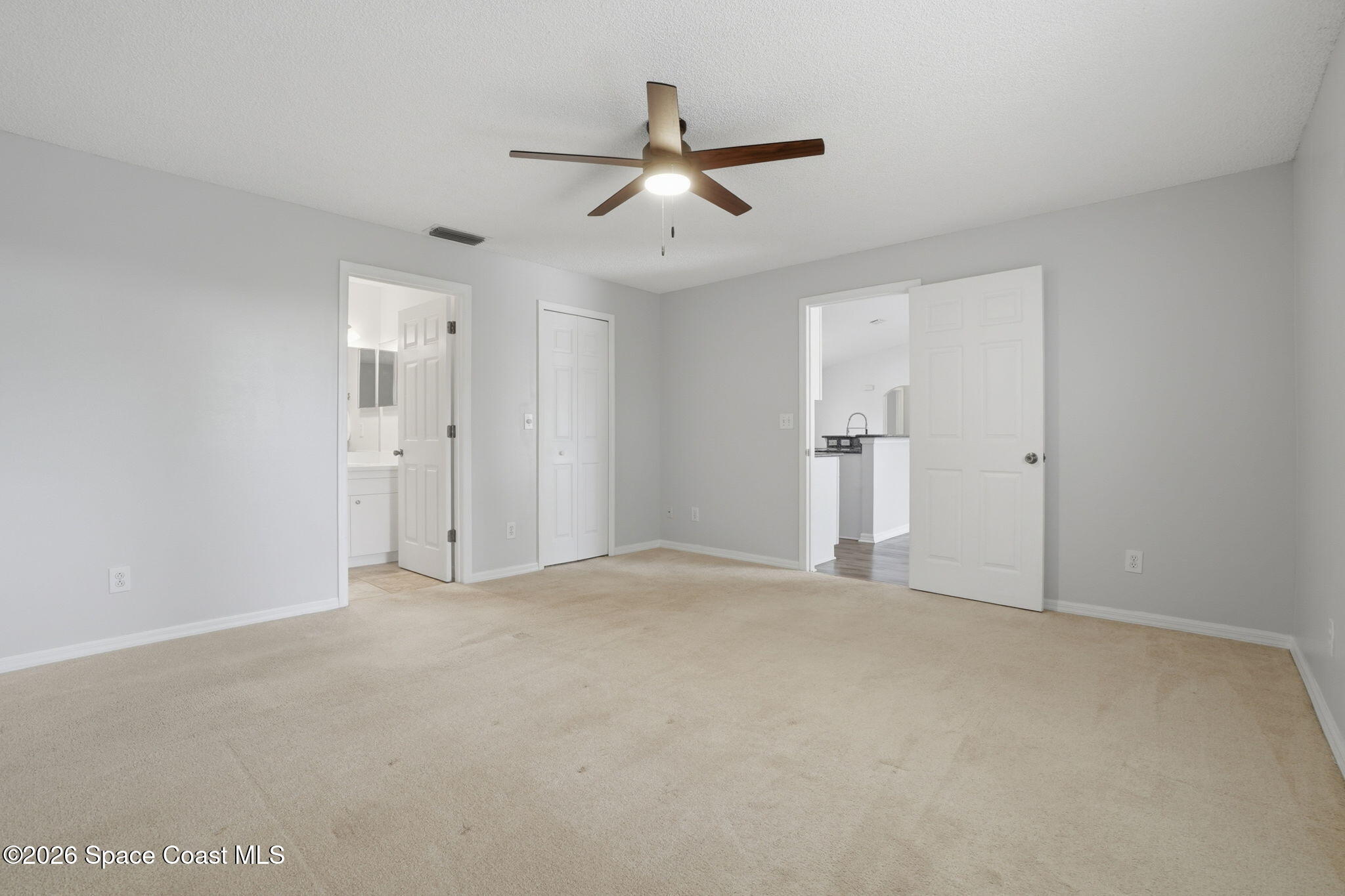 2005 Lansing Street Melbourne, FL 32935 - Photo 23 of 47 an empty room with closet and windows