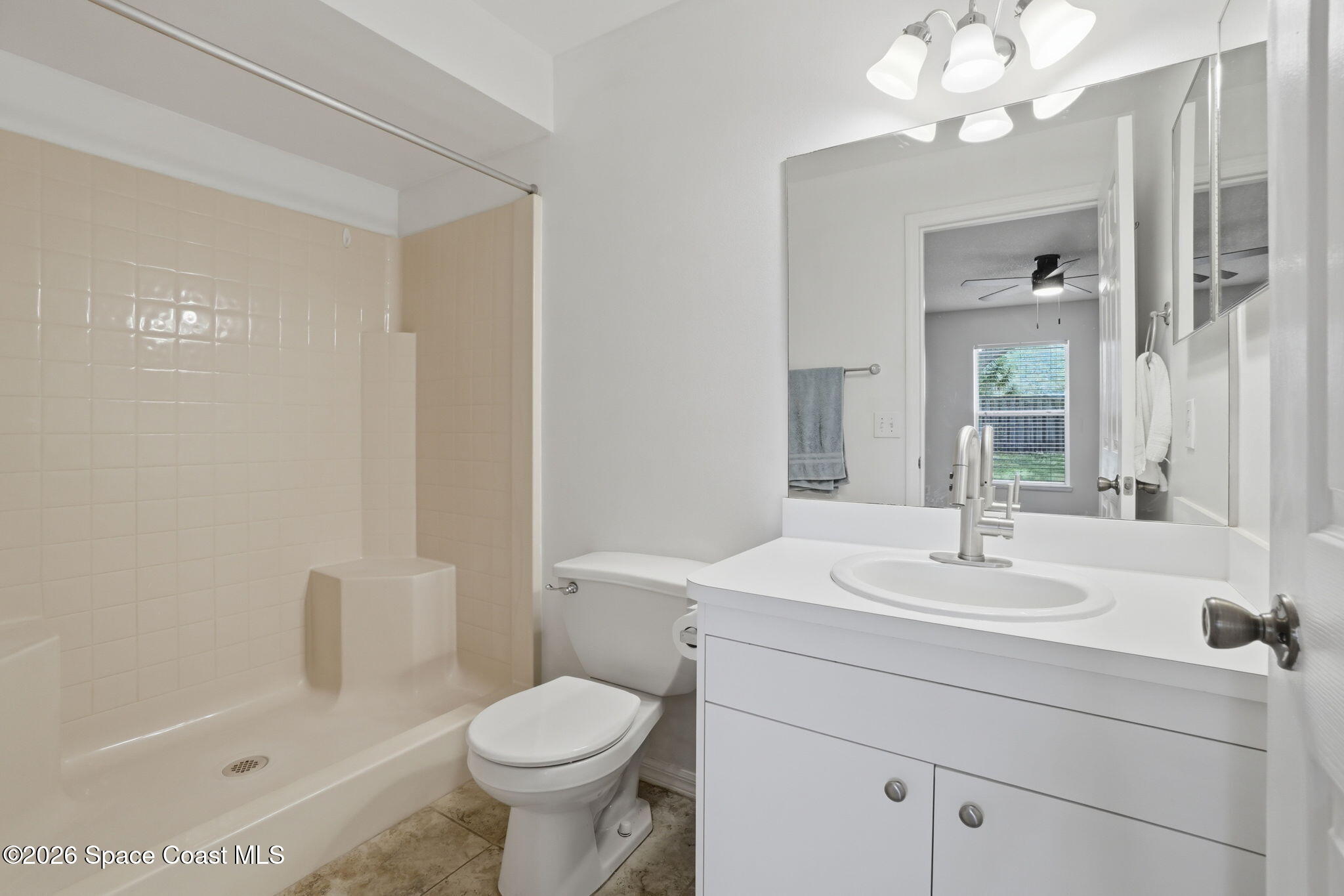 2005 Lansing Street Melbourne, FL 32935 - Photo 24 of 47 a bathroom with a sink a toilet and shower