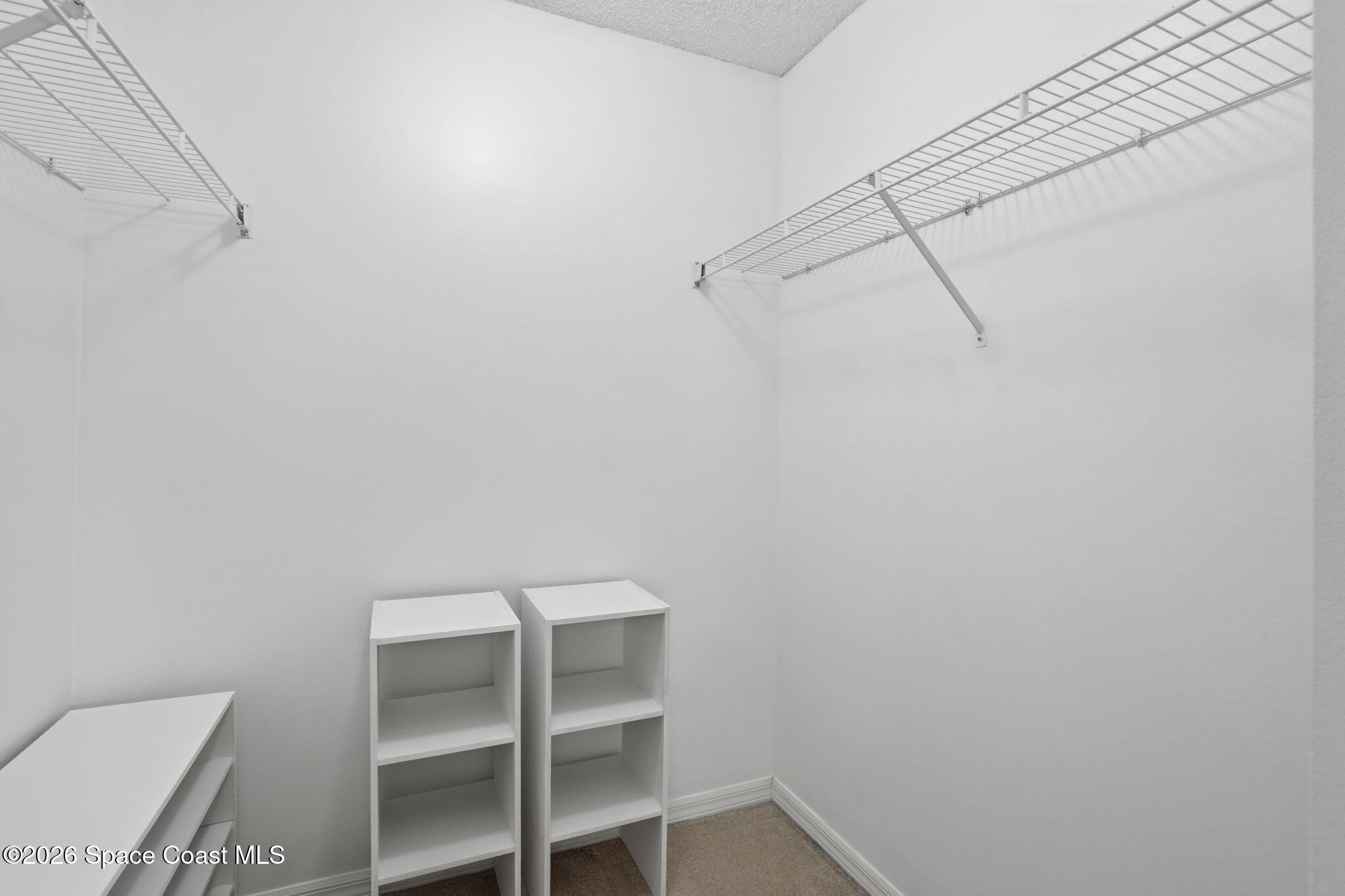 2005 Lansing Street Melbourne, FL 32935 - Photo 25 of 47 a view of a room with racks on the wall