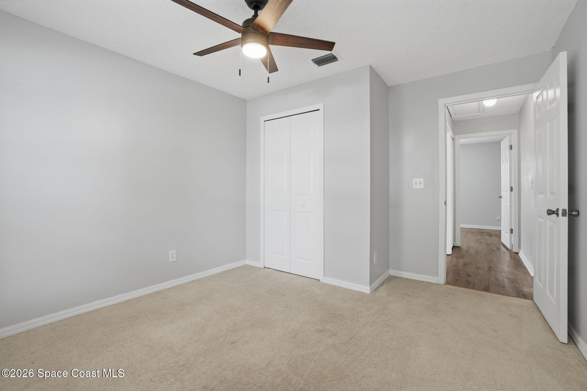 2005 Lansing Street Melbourne, FL 32935 - Photo 28 of 47 wooden floor in an empty room
