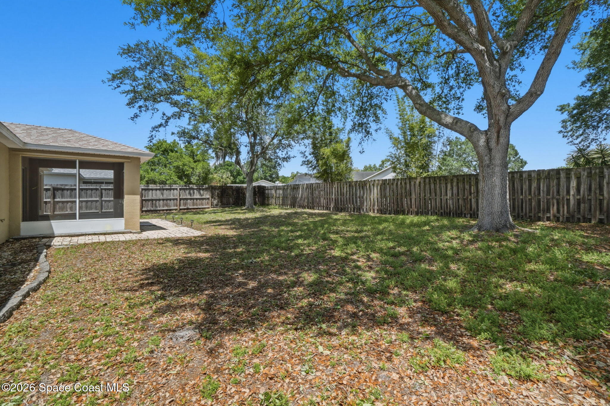 2005 Lansing Street Melbourne, FL 32935 - Photo 38 of 47 a backyard of a house with lots of green space