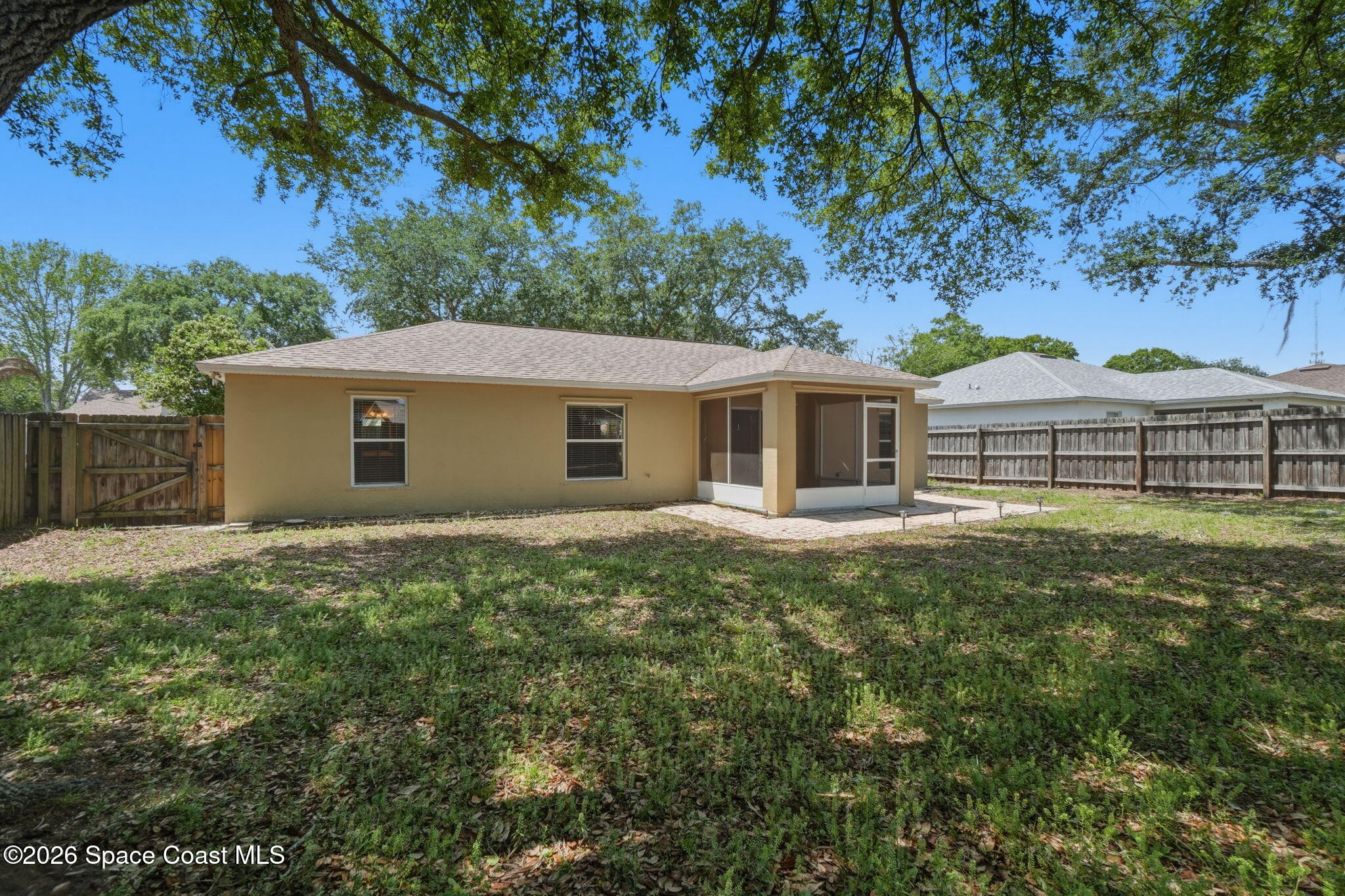 2005 Lansing Street Melbourne, FL 32935 - Photo 40 of 47 a front view of a house with a garden