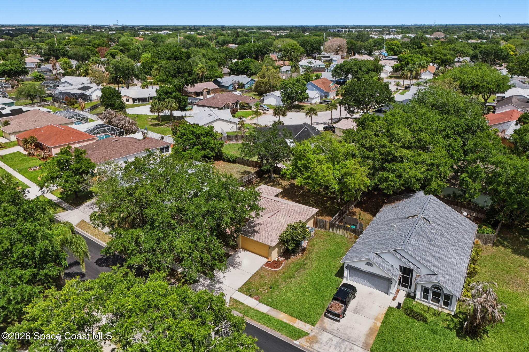 2005 Lansing Street Melbourne, FL 32935 - Photo 42 of 47 an aerial view of residential houses with outdoor space and trees