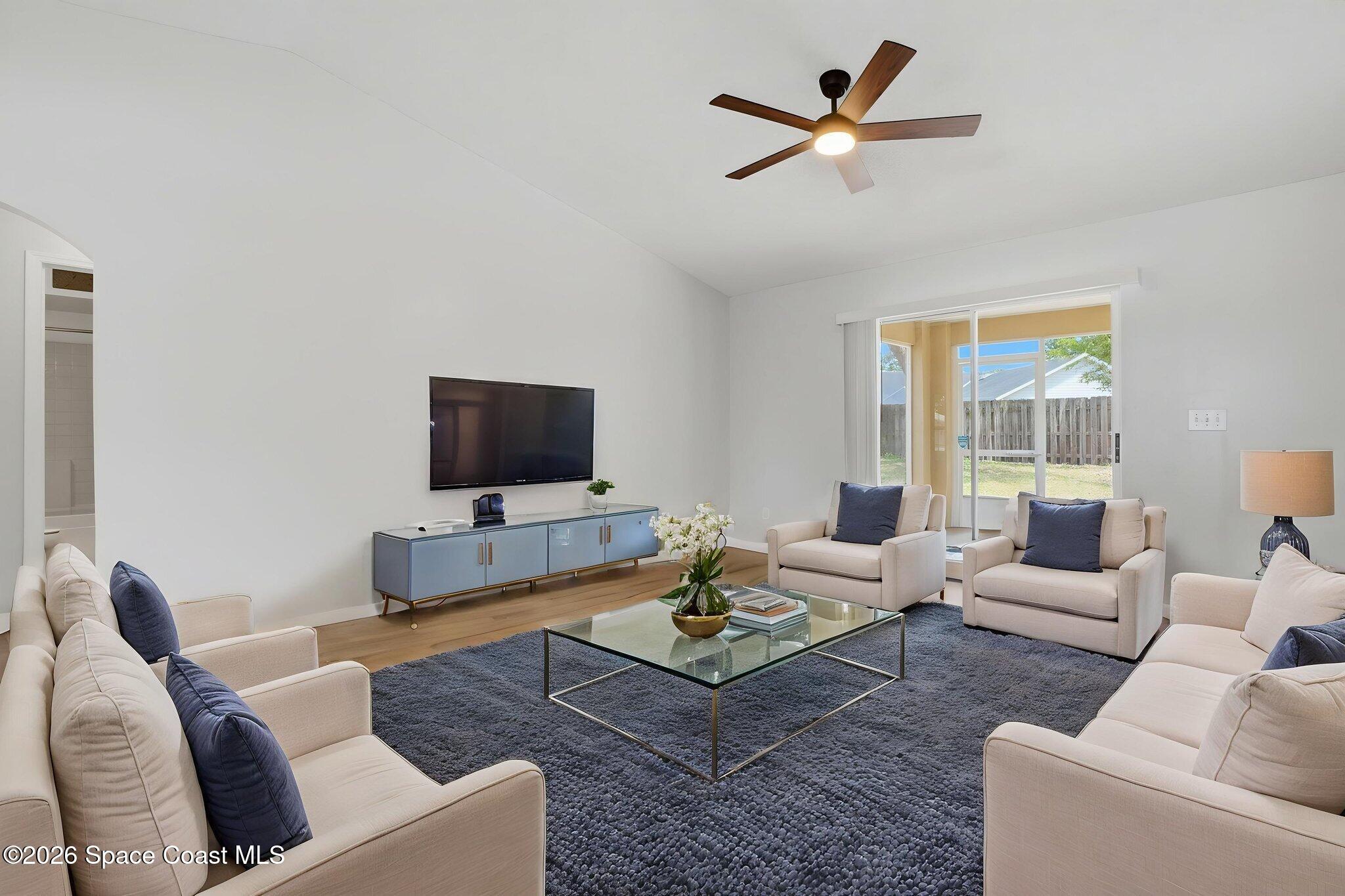 2005 Lansing Street Melbourne, FL 32935 - Photo 5 of 47 a living room with furniture and a flat screen tv