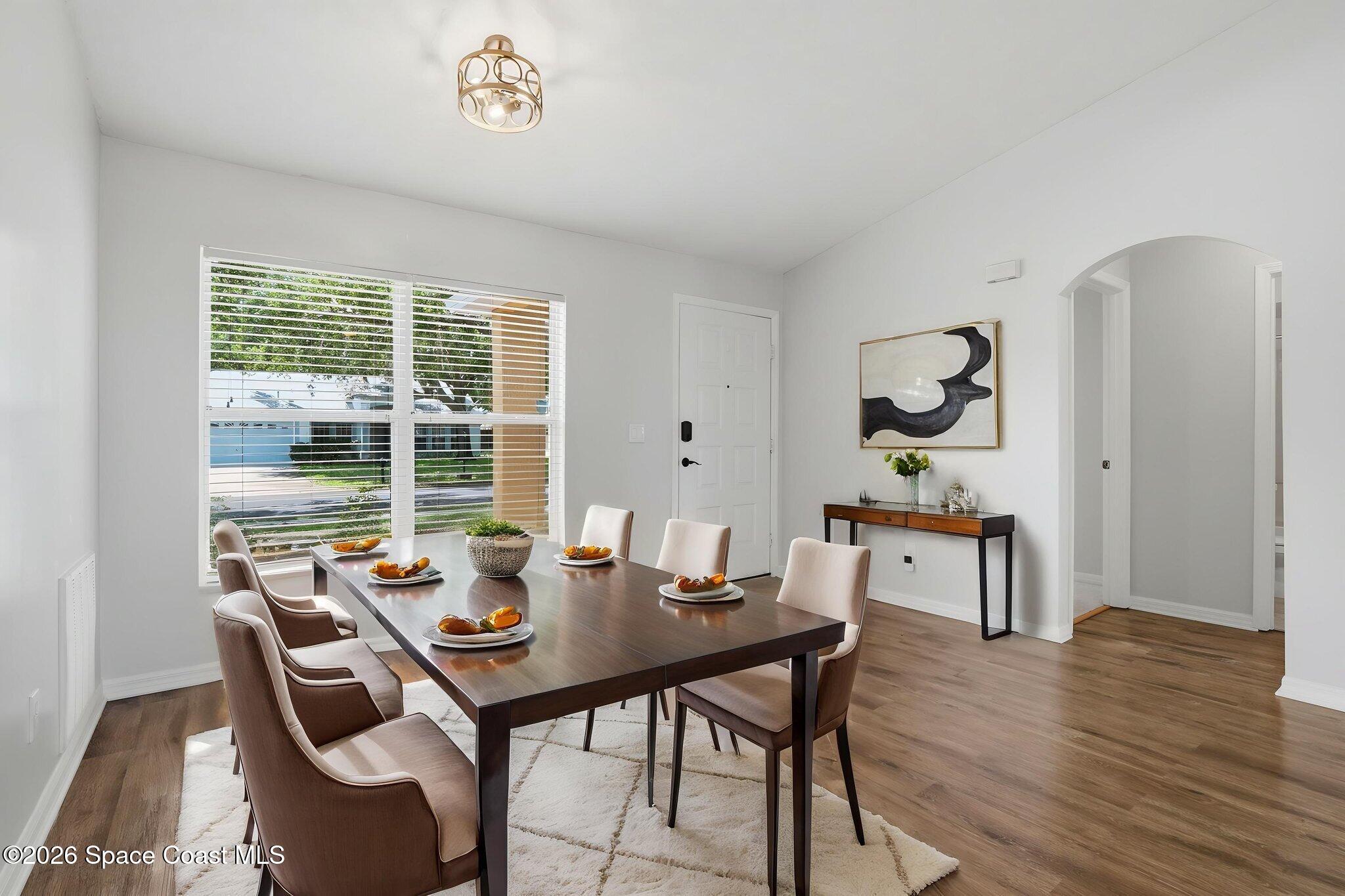 2005 Lansing Street Melbourne, FL 32935 - Photo 10 of 47 a view of a dining room with furniture window and wooden floor