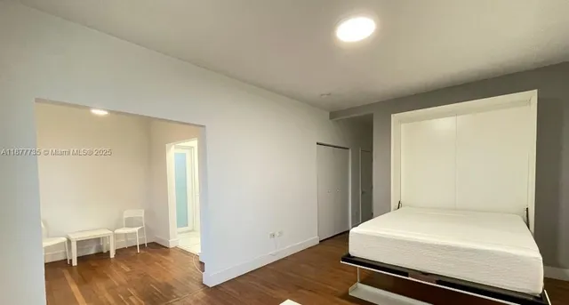 a room with a bed and a chair